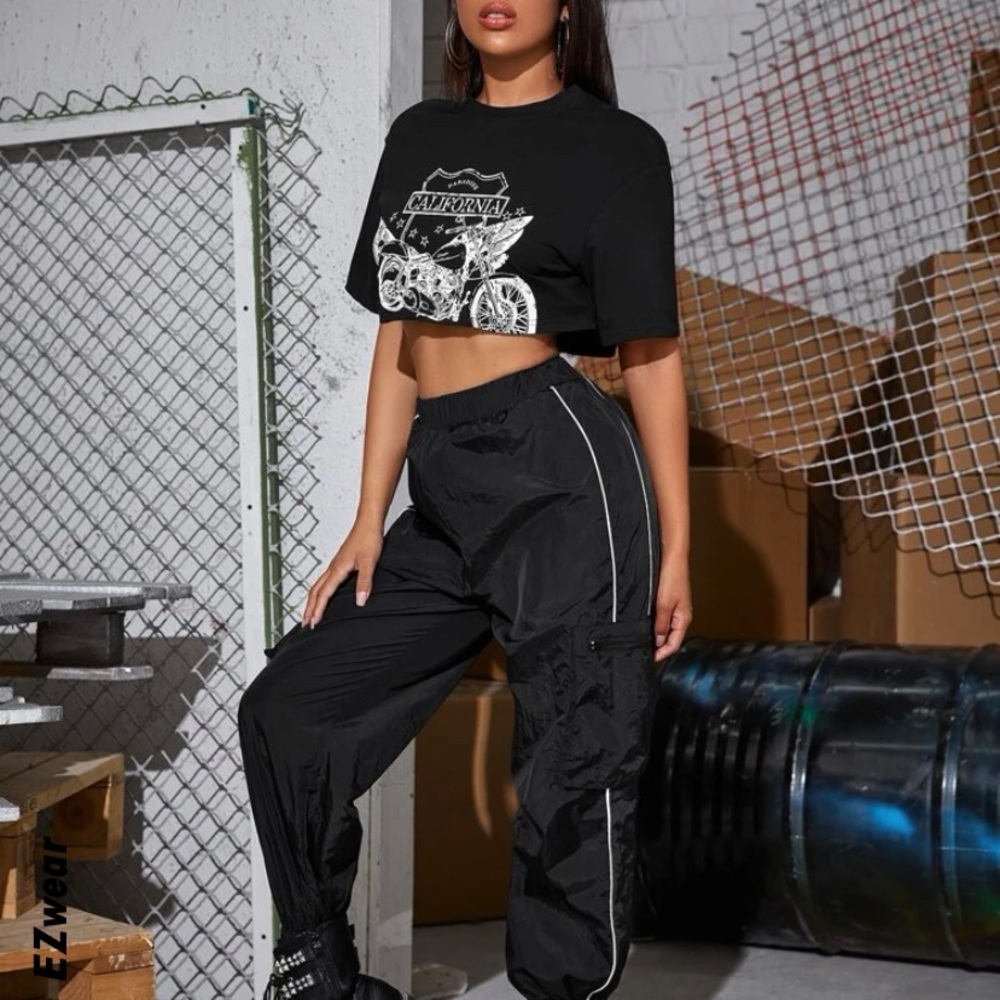 Windbreaker material pants with zipper pockets in a size medium